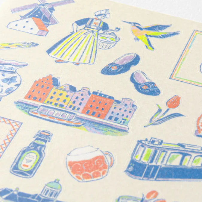 Illustrated pattern with buildings, a tram, and other elements on a beige background