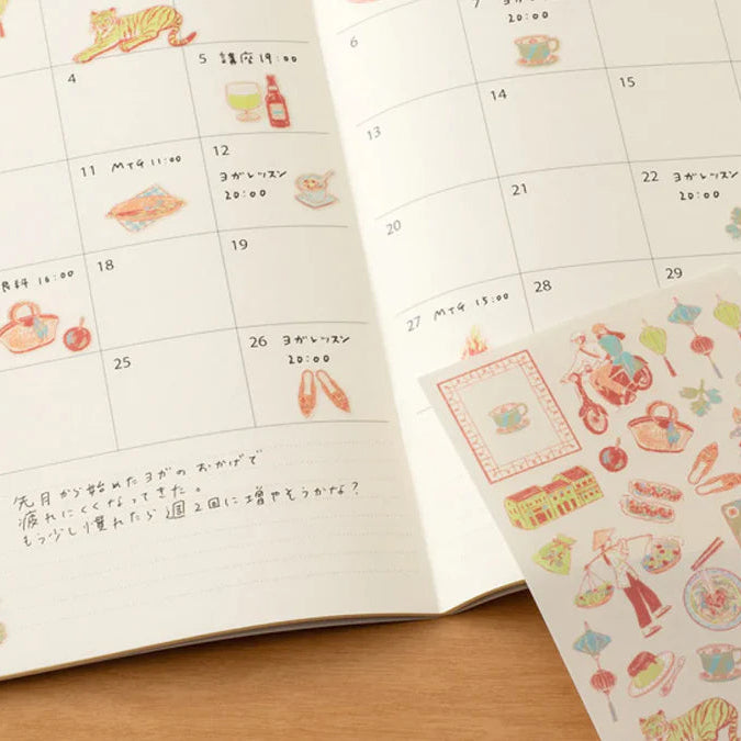 Calendar with stickers on a wooden surface