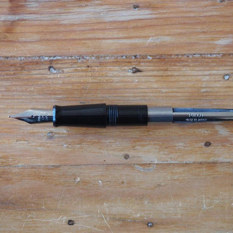 Fountain pen on a wooden surface